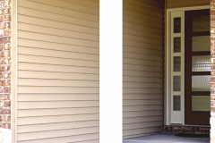 Front porch detail with white porch column, horizontal siding, and a shaded entry area