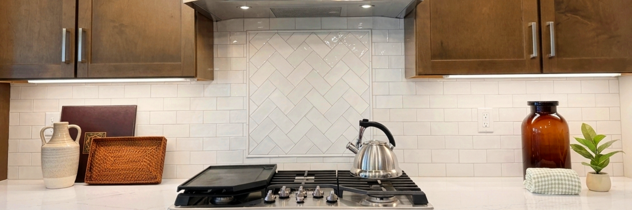 Bright, welcoming villa kitchen with warm finishes, natural light, and everyday functionality.